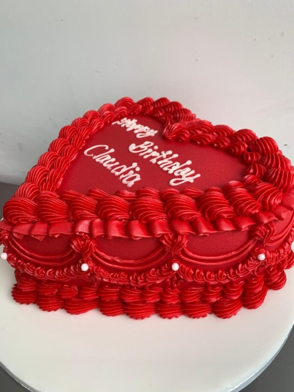 Red vintage heart cake with ornate Lambeth piping, layered shell borders, scalloped swags, pearl accents and custom white message