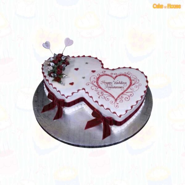 White interlocking double-heart anniversary cake with burgundy borders, ornate heart artwork, burgundy roses, silver leaves, heart toppers and ribbon bows