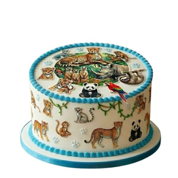 Blue safari animal kids birthday cake with round white icing, animal prints, paw details and blue piped border