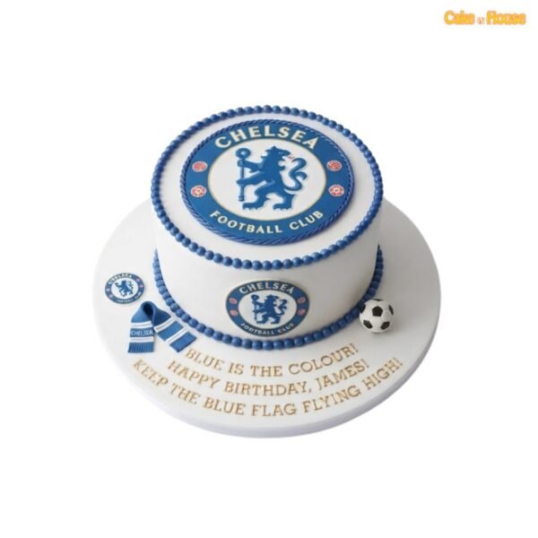 White round Chelsea football cake with a large blue club crest, matching side badge, blue pearl borders, miniature scarf and football