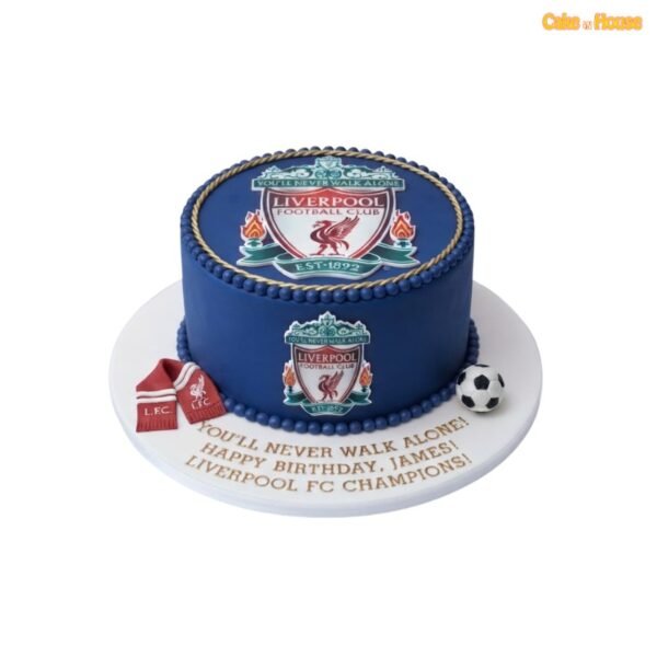 Navy blue Liverpool FC birthday cake with large top crest, matching side badge, gold rope trim, blue pearl border, scarf and football