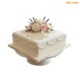 Eileen elegant floral retirement cake with ivory icing, pearl draping, rose toppers, lavender accents and gold retirement message
