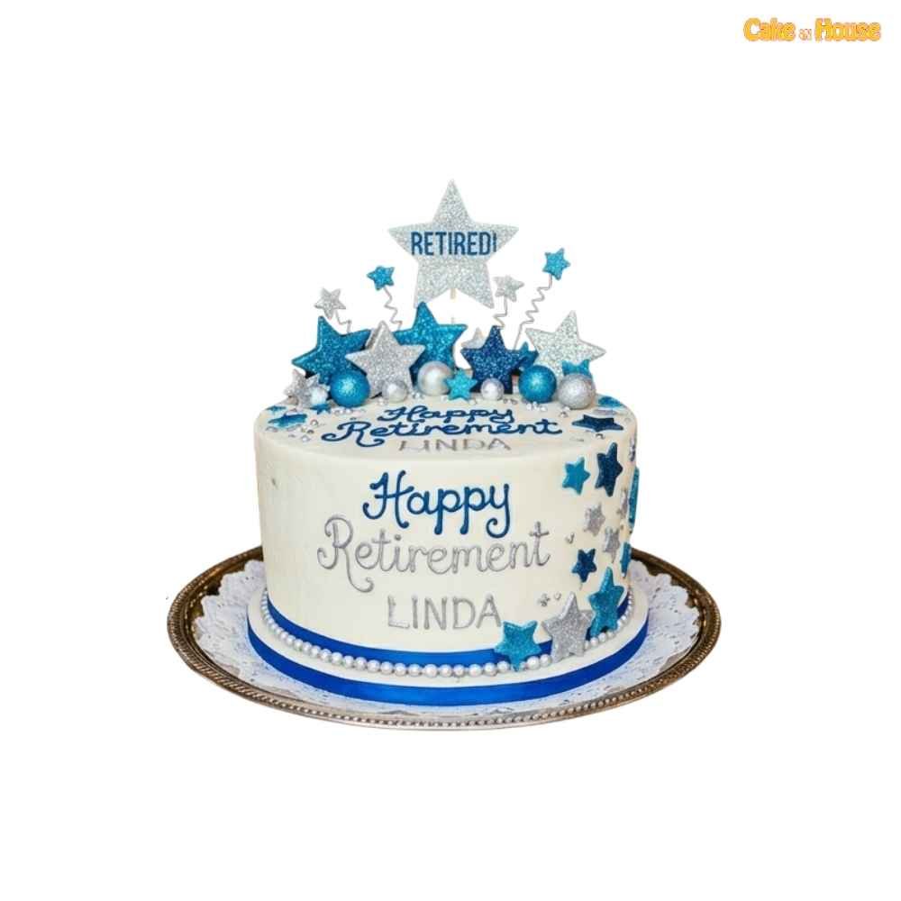 Elegant retirement celebration cake with blue and silver glitter stars, personalised Linda message, pearl border and sparkling retired topper