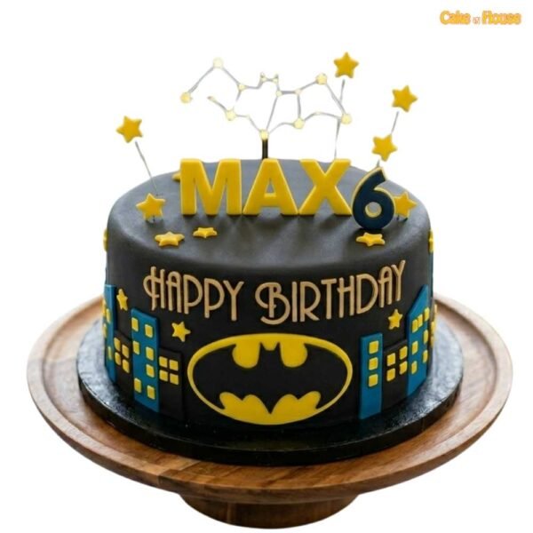 Max Bat Signal Skyline 6th birthday cake with black fondant, yellow bat logo, blue city skyline, stars and personalised name topper