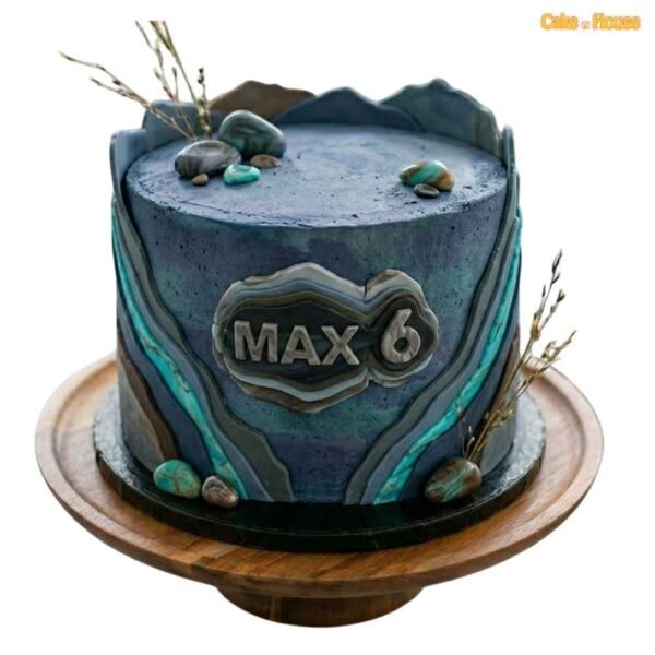 Max blue geode crystal 6th birthday cake with stone-effect icing, teal geode lines, pebbles and personalised name plaque
