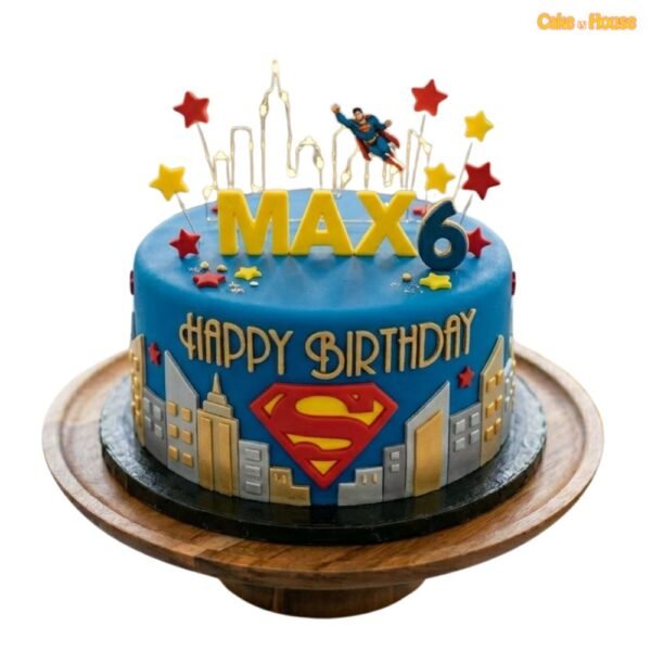 Max Superman Skyline 6th birthday cake with blue fondant, Superman logo, flying superhero topper, city skyline and stars