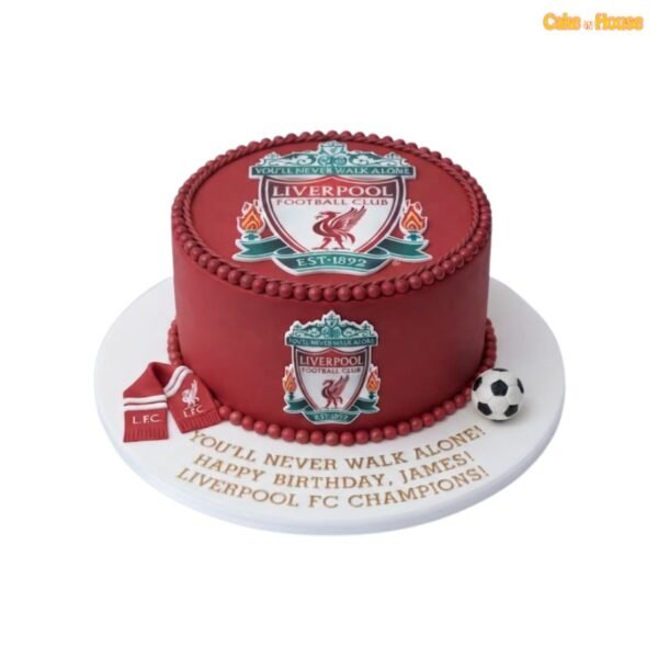 Deep red Liverpool FC birthday cake with club crests on the top and side, red pearl borders, miniature scarf and football decoration