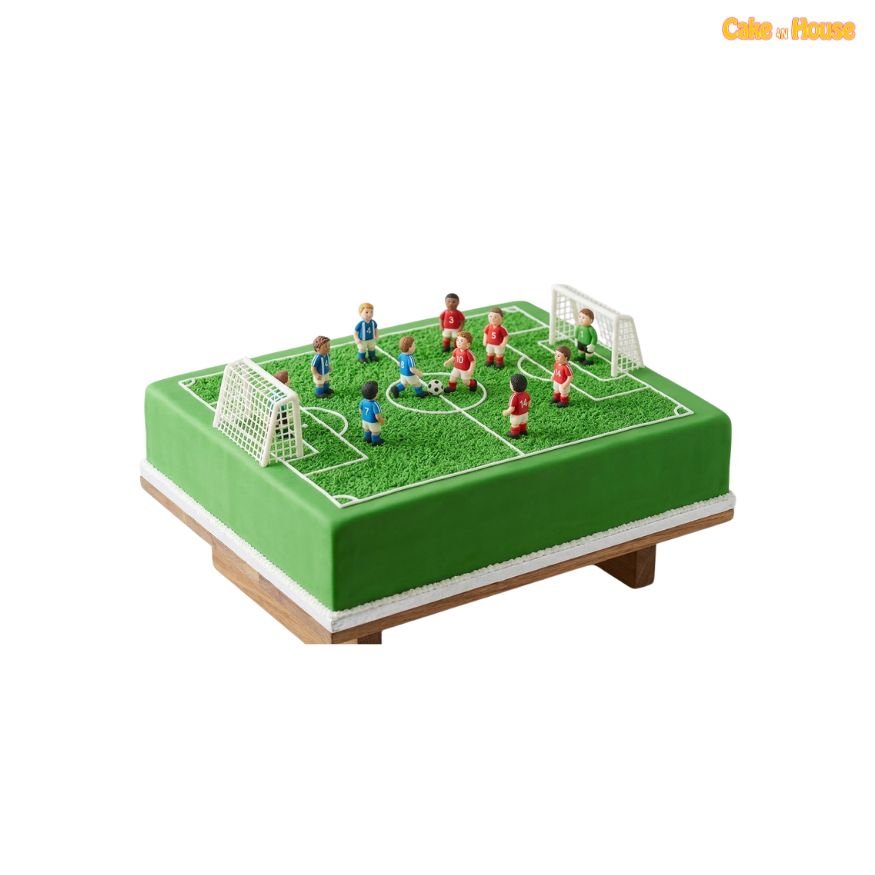 Large rectangular green football pitch cake with white field markings, two goals and detailed football player figurines arranged for a match