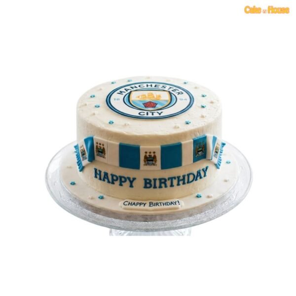 Ivory Manchester City football birthday cake with club crest, blue-and-white scarf panels, blue stars and personalised lettering